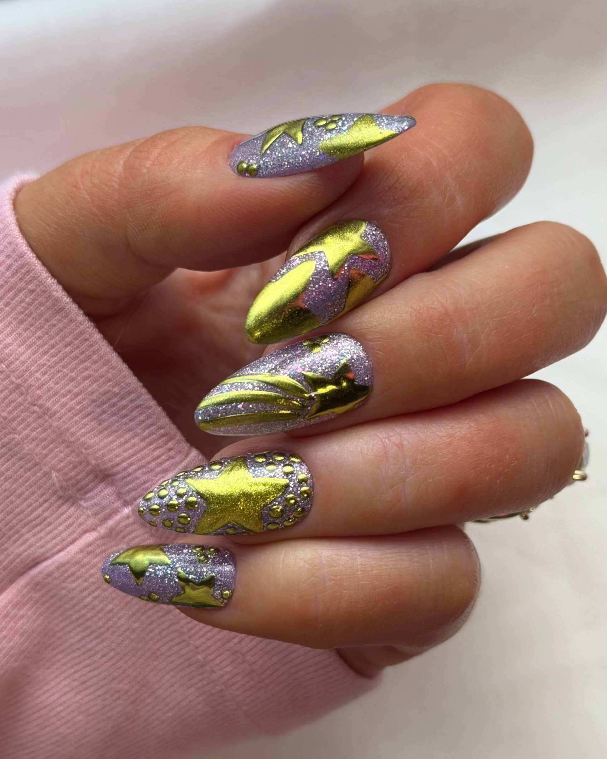 A celestial-inspired luxe set featuring metallic chrome stars, shimmering lavender glitter, and dimensional details designed to shine from eery angle.